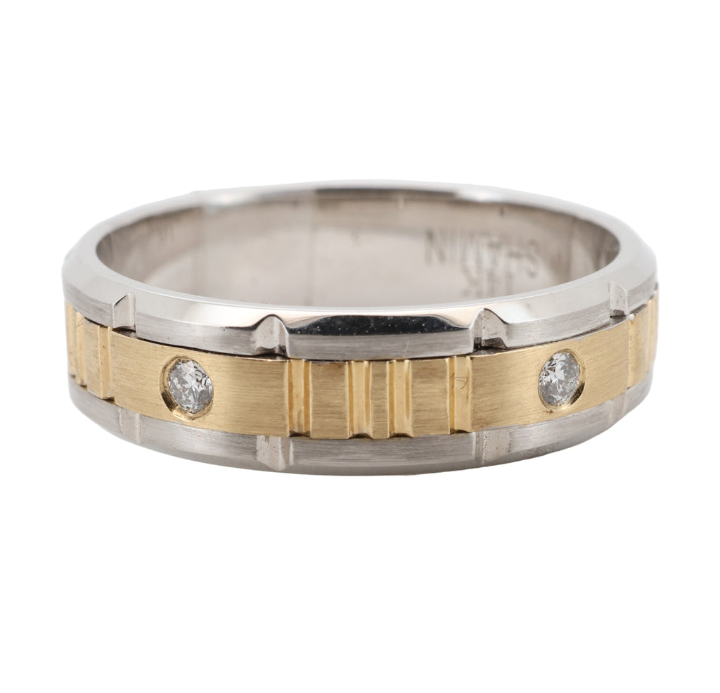 Two-tone ring with diamonds on a white background