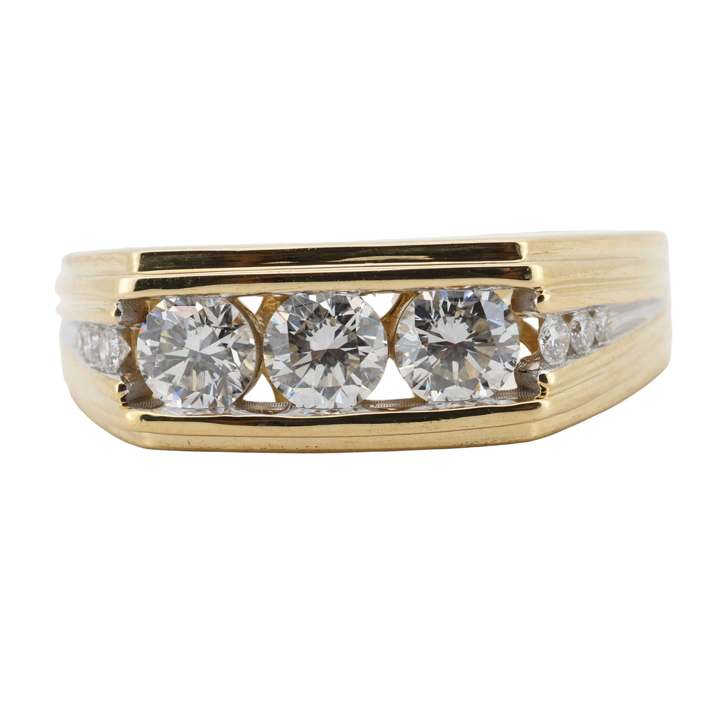 Gold ring with three diamonds on a white background